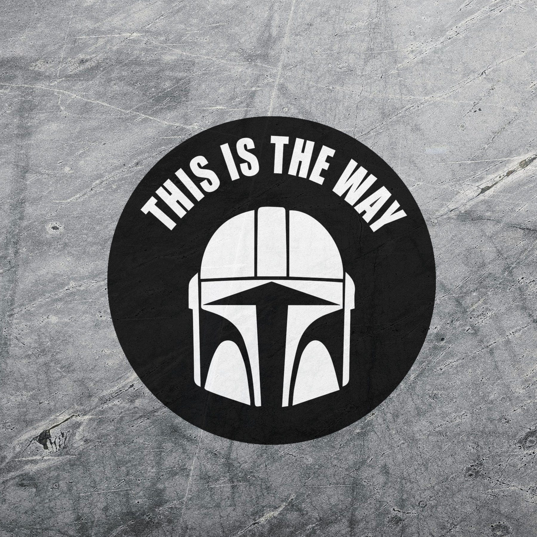 Custom Mandalorian-inspired vinyl decal with a white helmet graphic and the phrase “This Is The Way” in bold lettering on a black circular background.