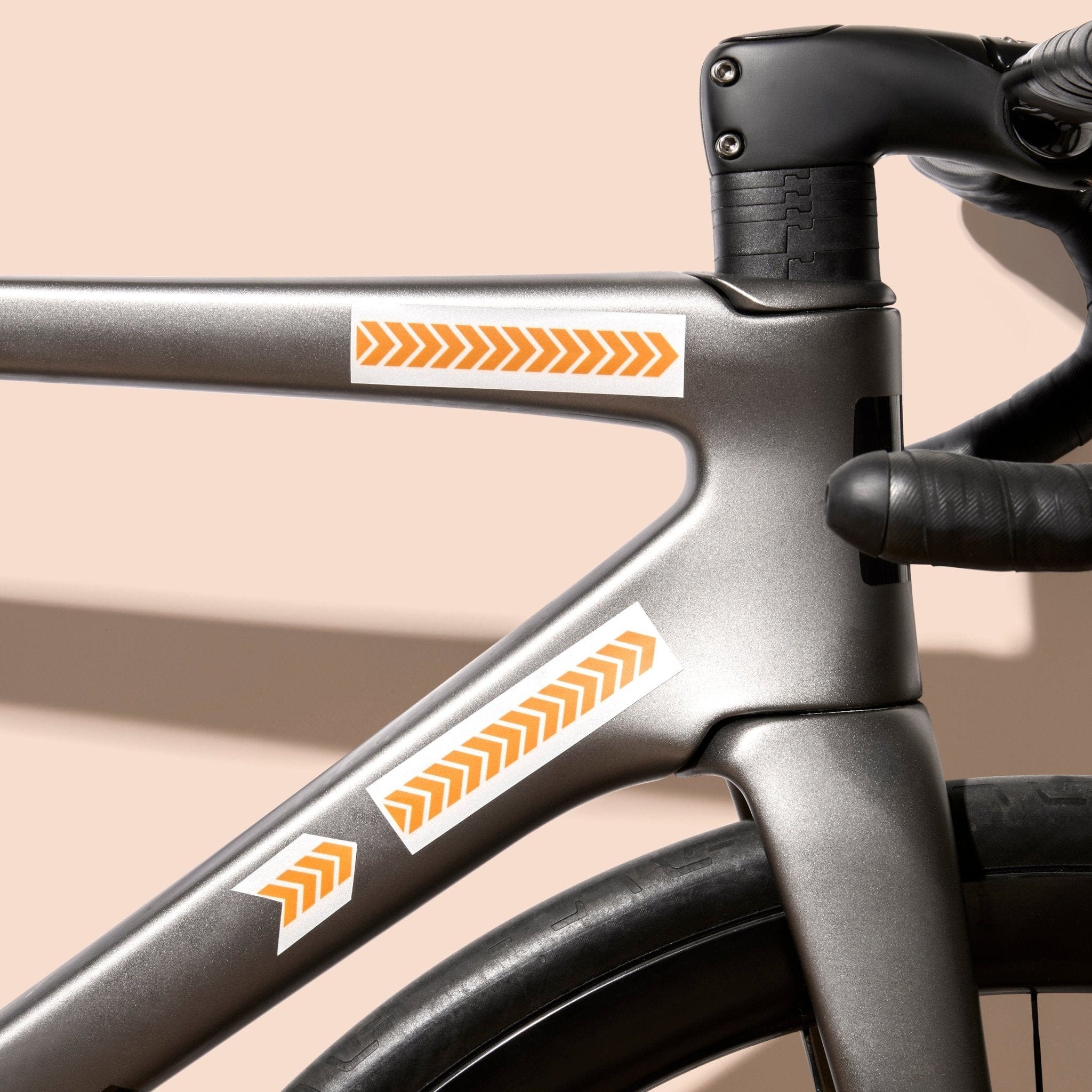 Reflective stickers with orange safety arrows on a bike