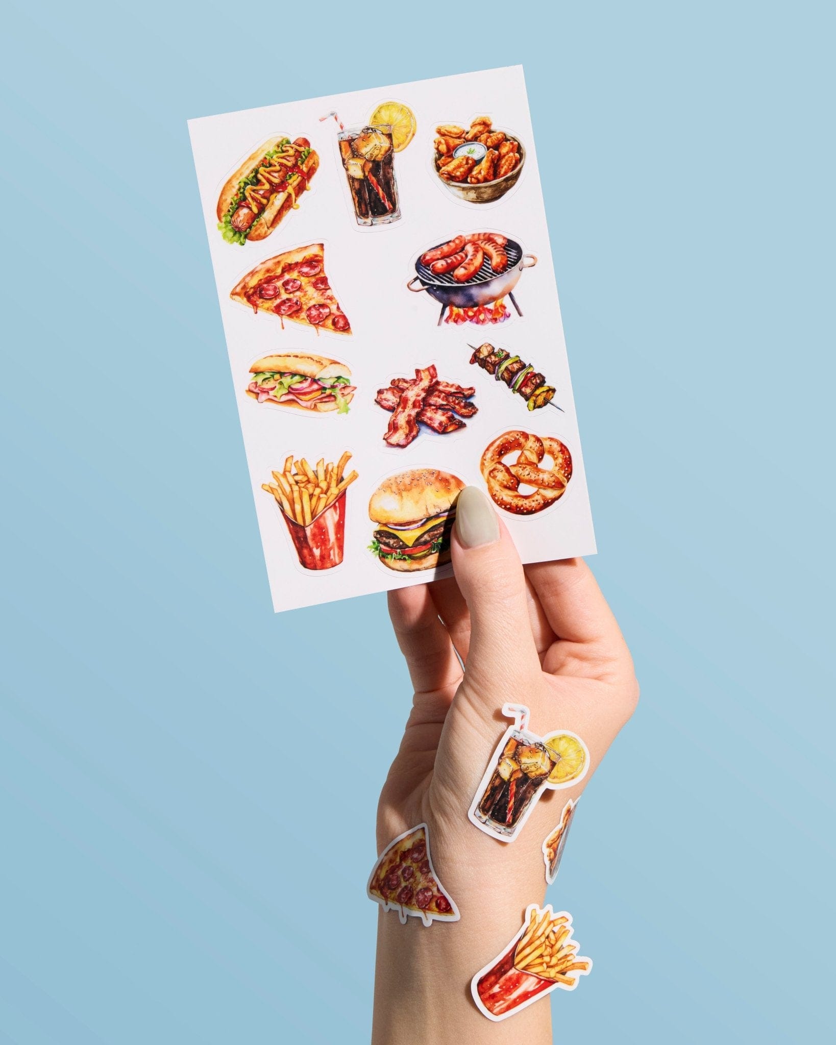 Custom sticker sheet featuring food illustrations held in hand